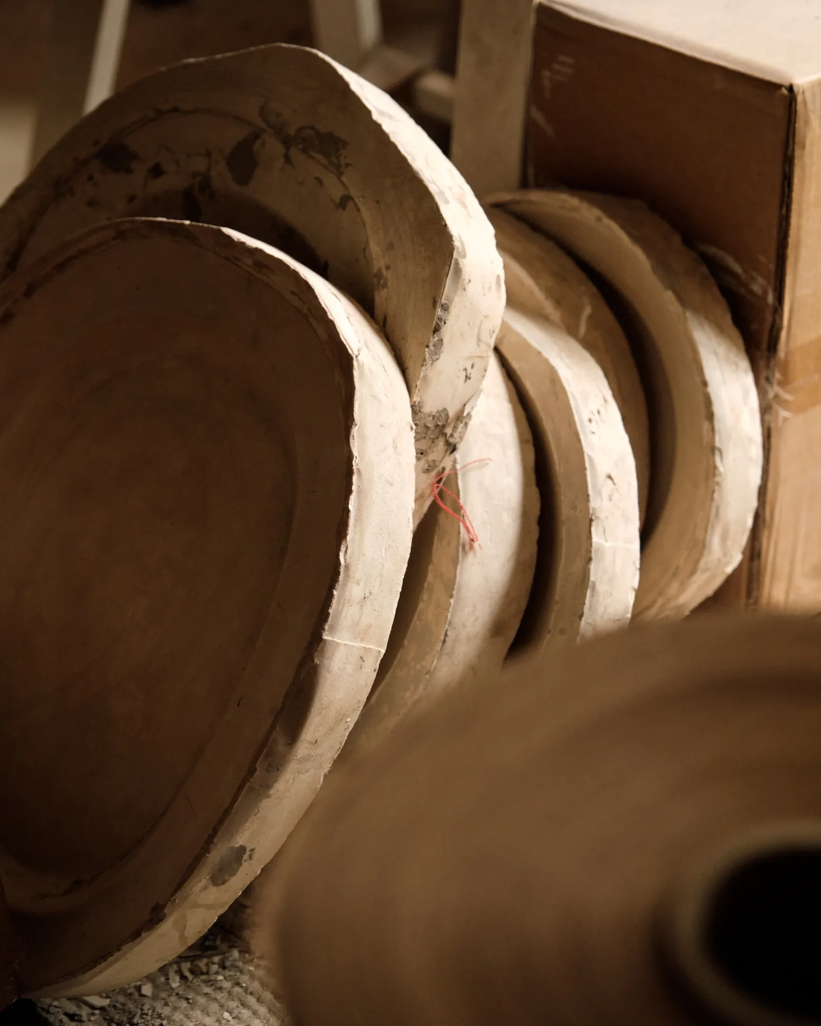 A stack of moulds used to create plates.