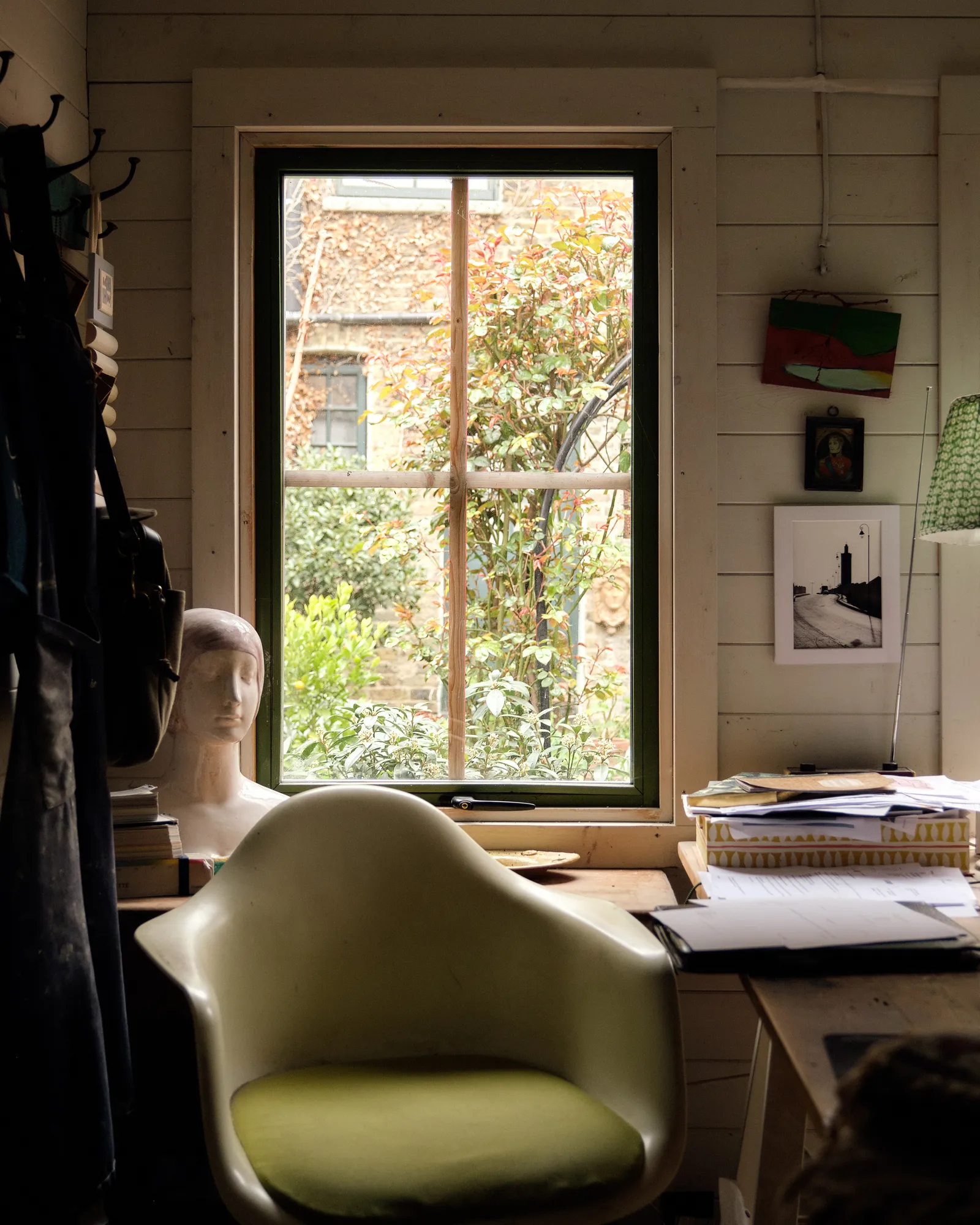 The bust on the windowsill is used as a mould for Gavin's 'pothead' vases.