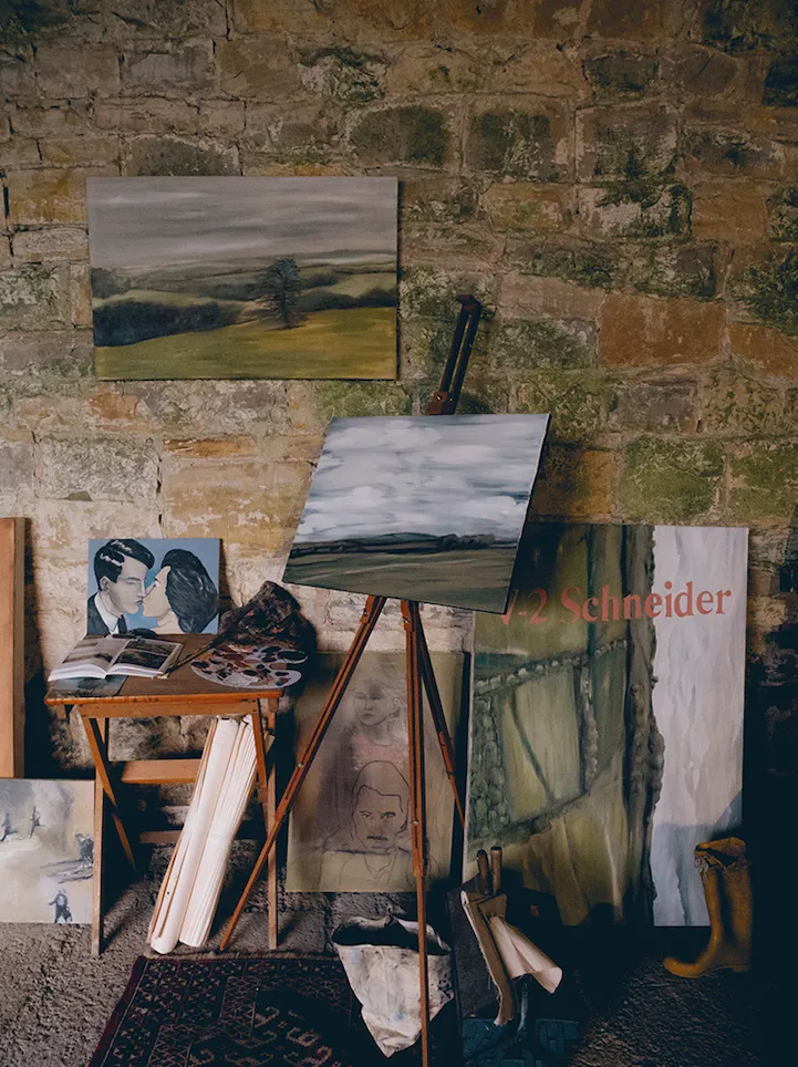 Photographs, magazine cuttings and fragments of imagery are taped up beside unfinished paintings, evidence of an ongoing conversation between his practice.
