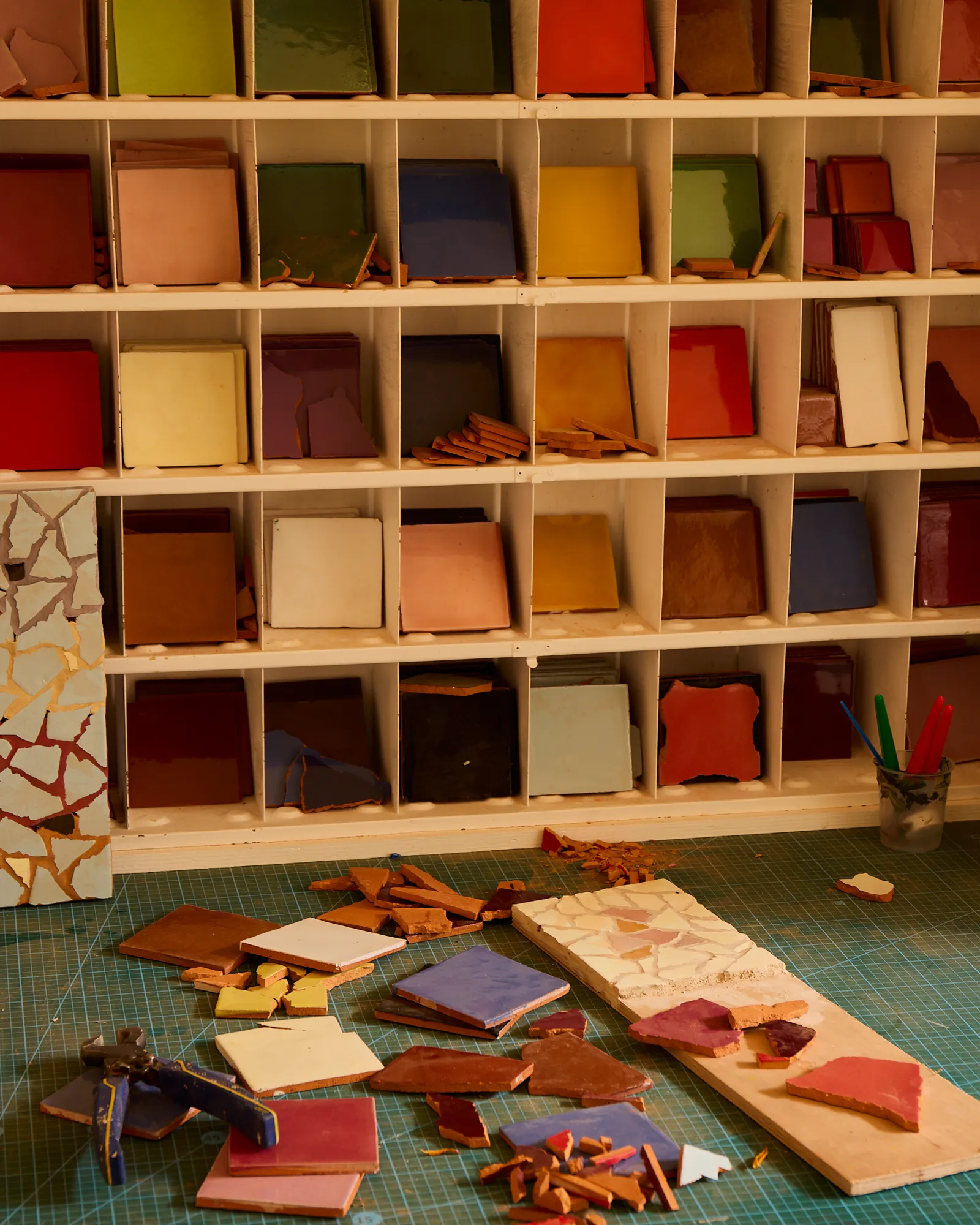 An old post office letter rack that Charlie found at a flea market in Shepton Mallet. Now it helps him choose colour combinations.