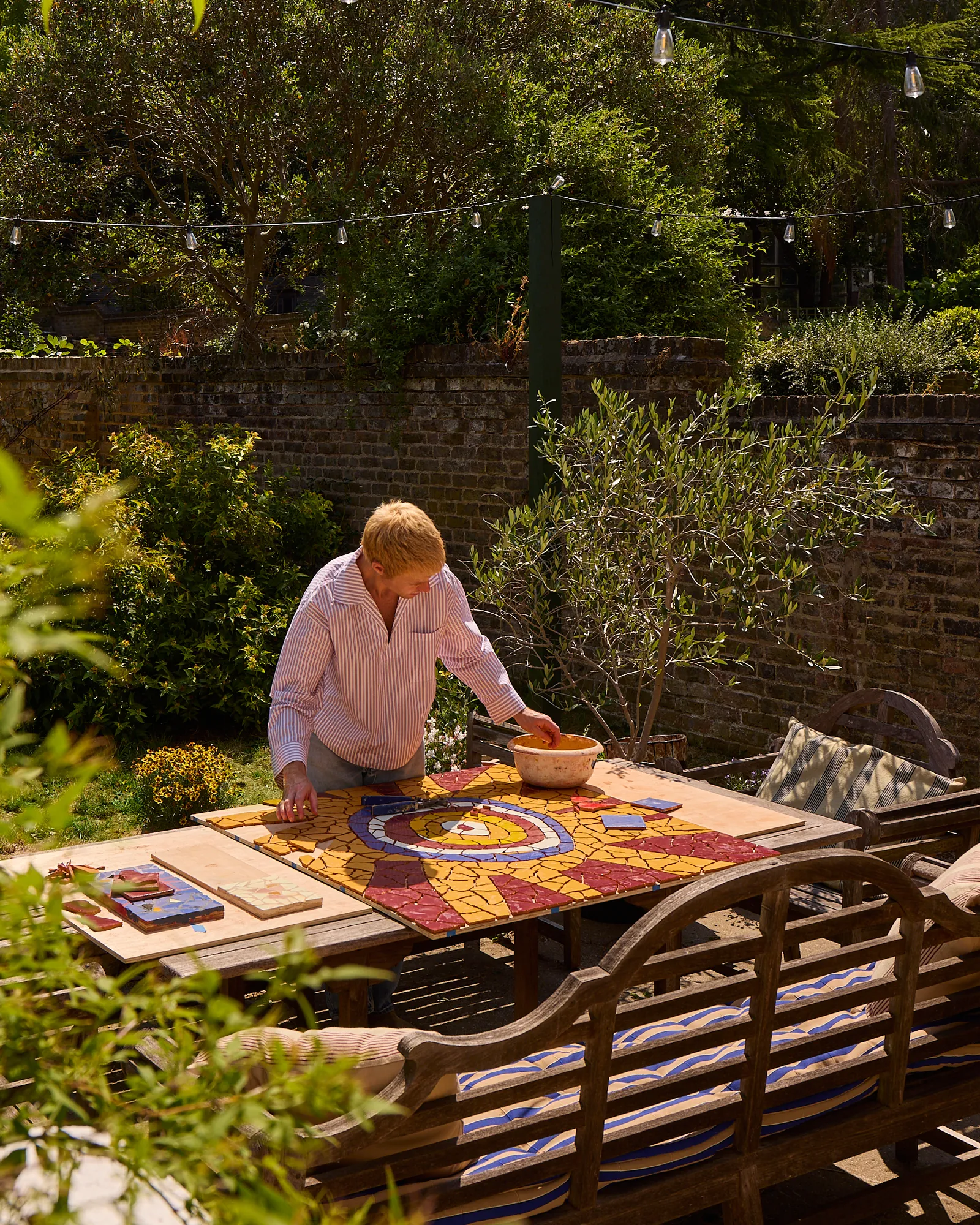 Much of the exhibition has been conceived and made outdoors, surrounded by the very plants that find their way into the finished mosaics.