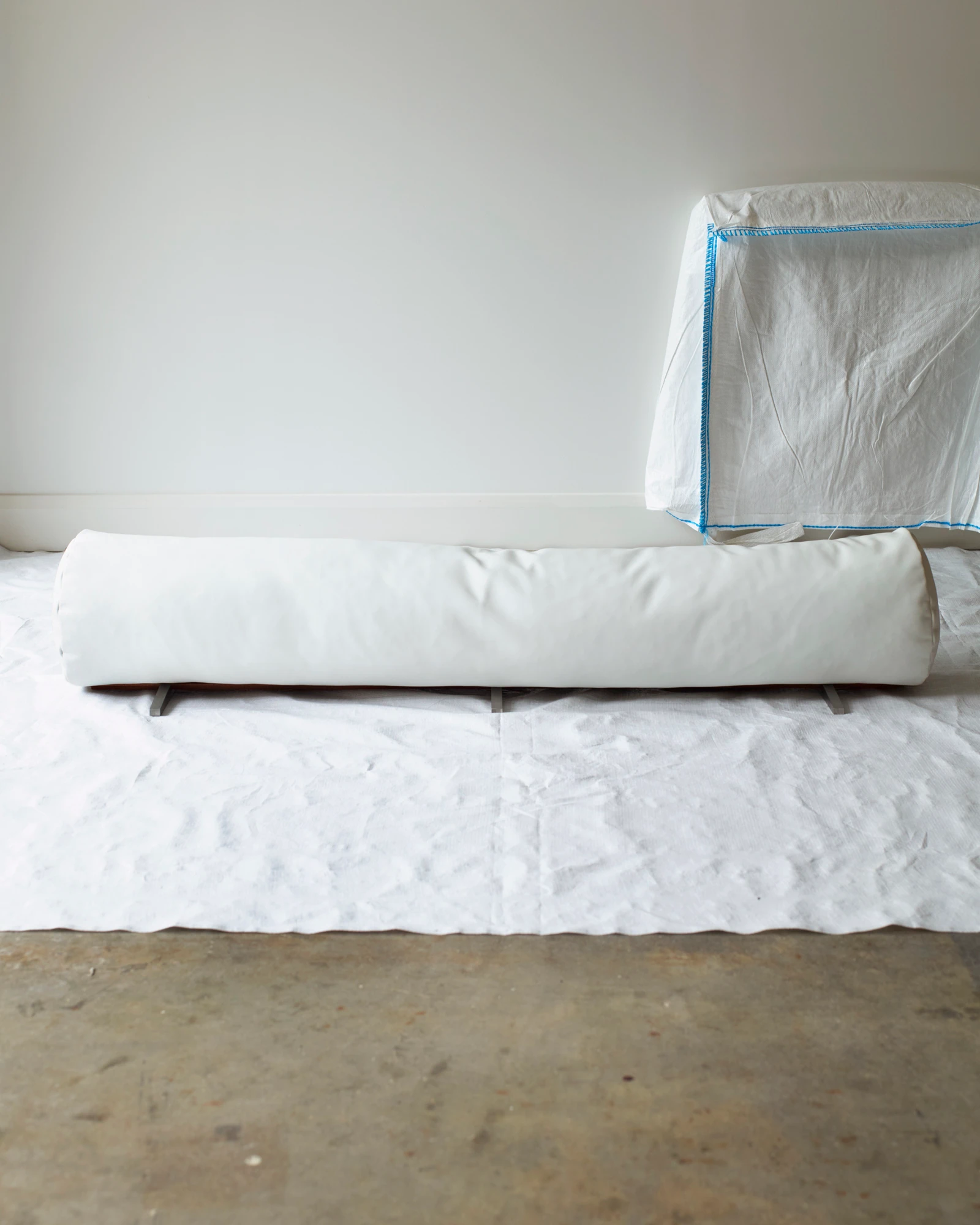 The Architectural Completion of a Floor Bolster Cushion – White