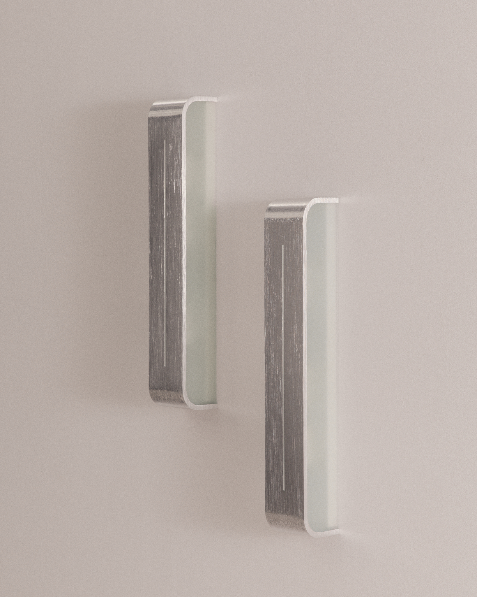 Pair of brushed aluminium wall lamps