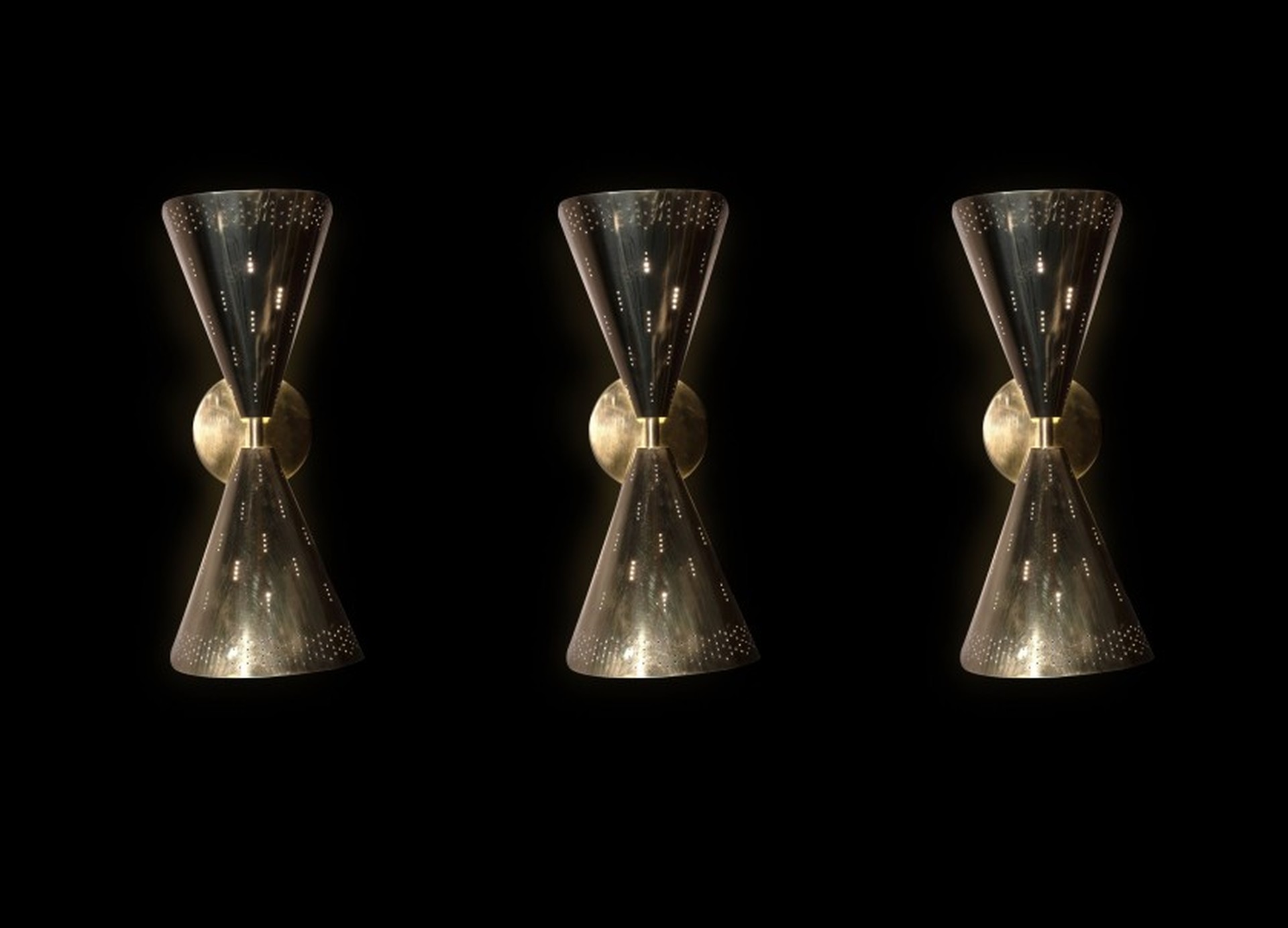 A set of three brass wall lamps
