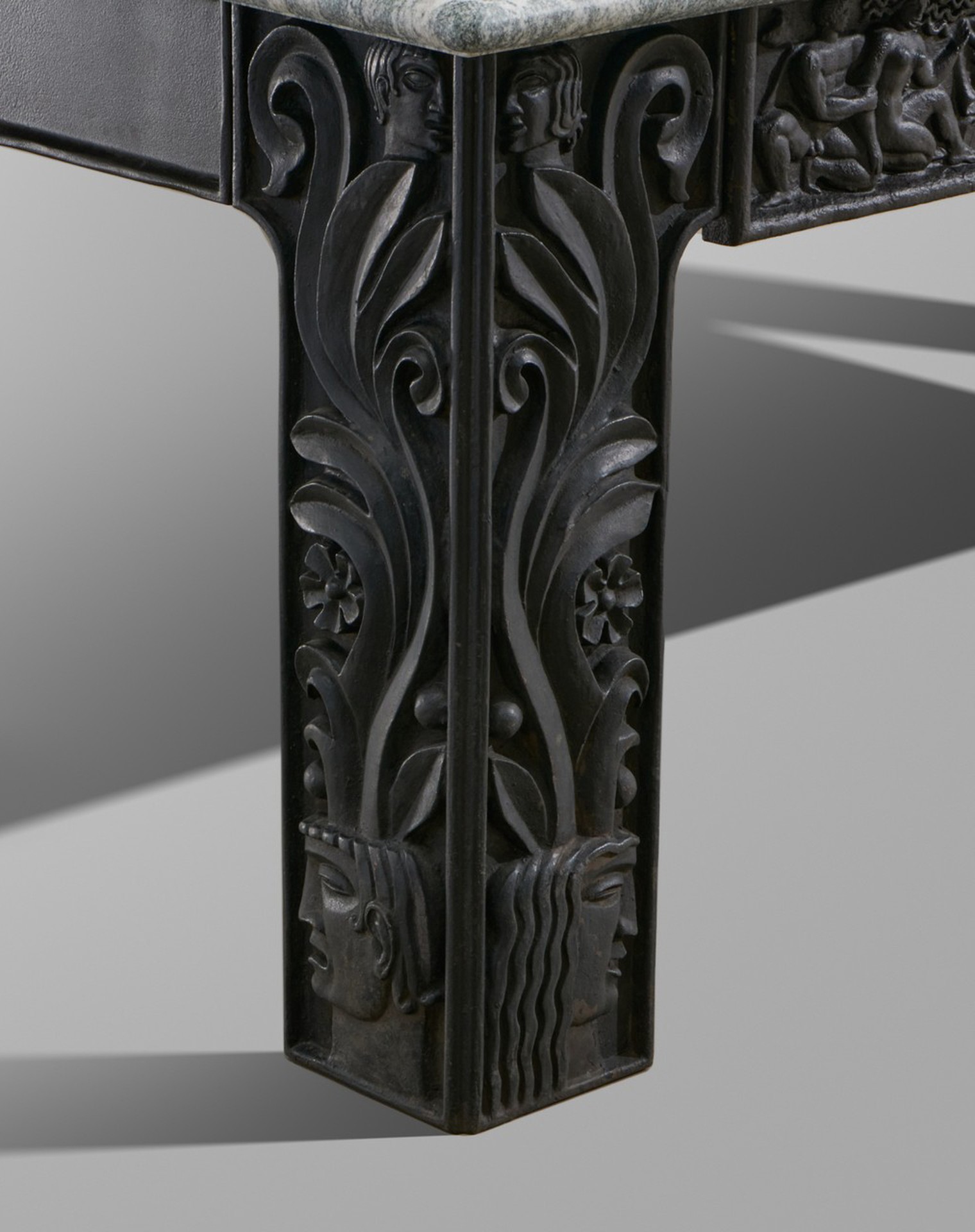 Anna Petrus, Table, 1927, Cast-iron, partly painted black, relief decoration throughout, granite top, Produced by Näfveqvarns Bruk.