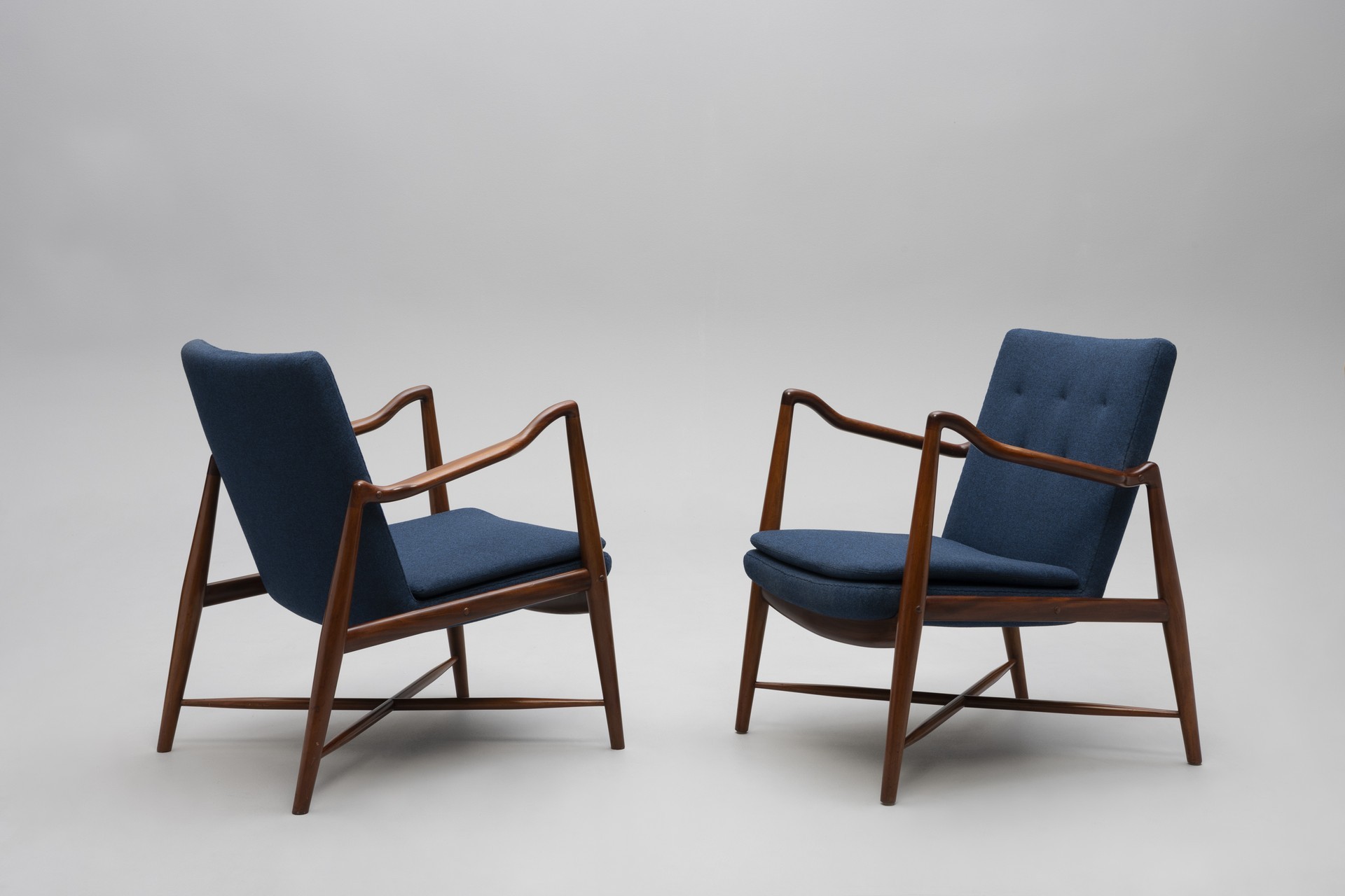 Rare pair of 'Westermann Fireplace' armchairs. Designed by Finn Juhl. Executed by Niels Vodder. 1943. Cuban mahogany, Oregon pine, wool upholstery.