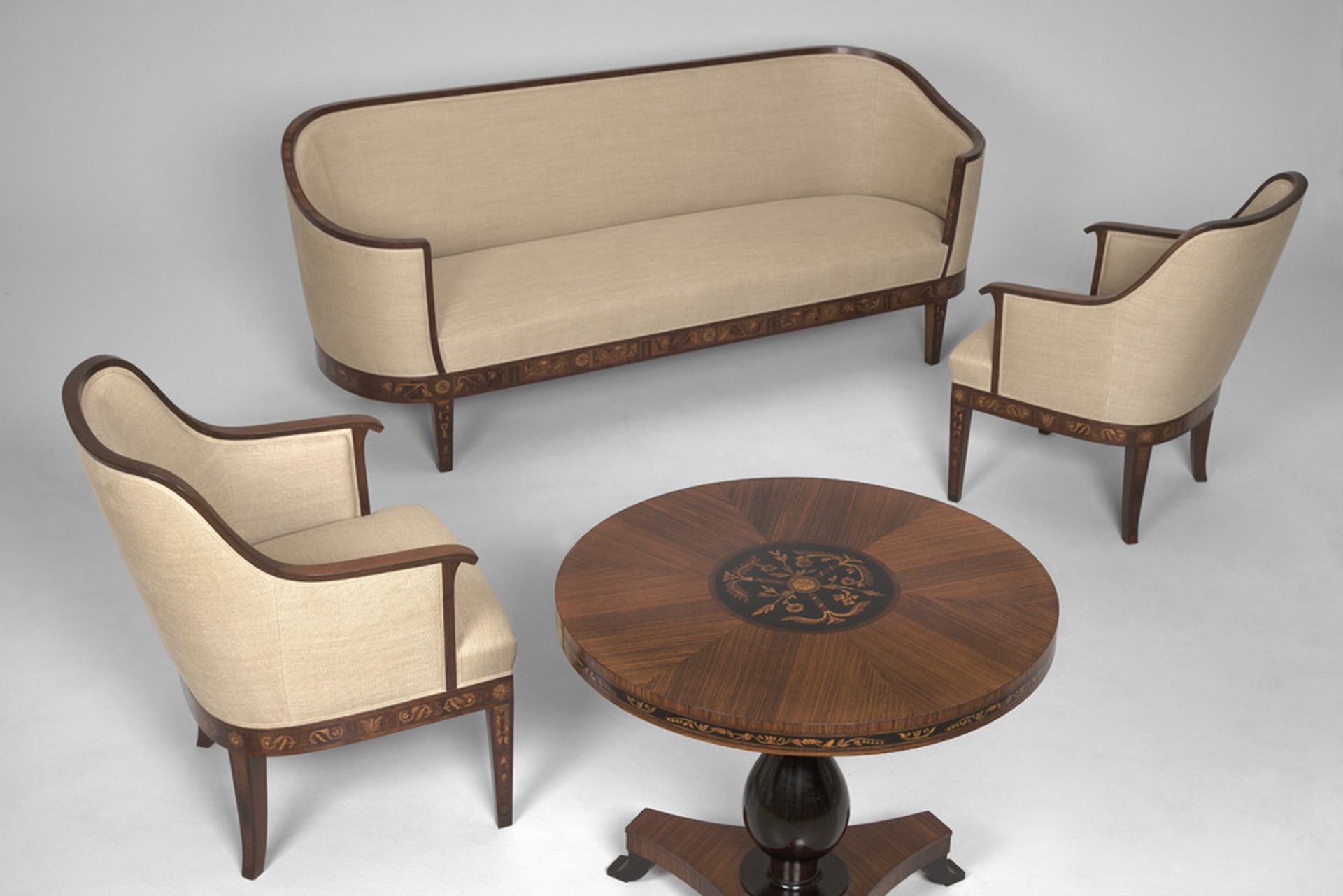 No.8639. Malmsten Sofa, pair of armchairs, and table in rosewood, inlays of several different fruit woods. Ca 1940.