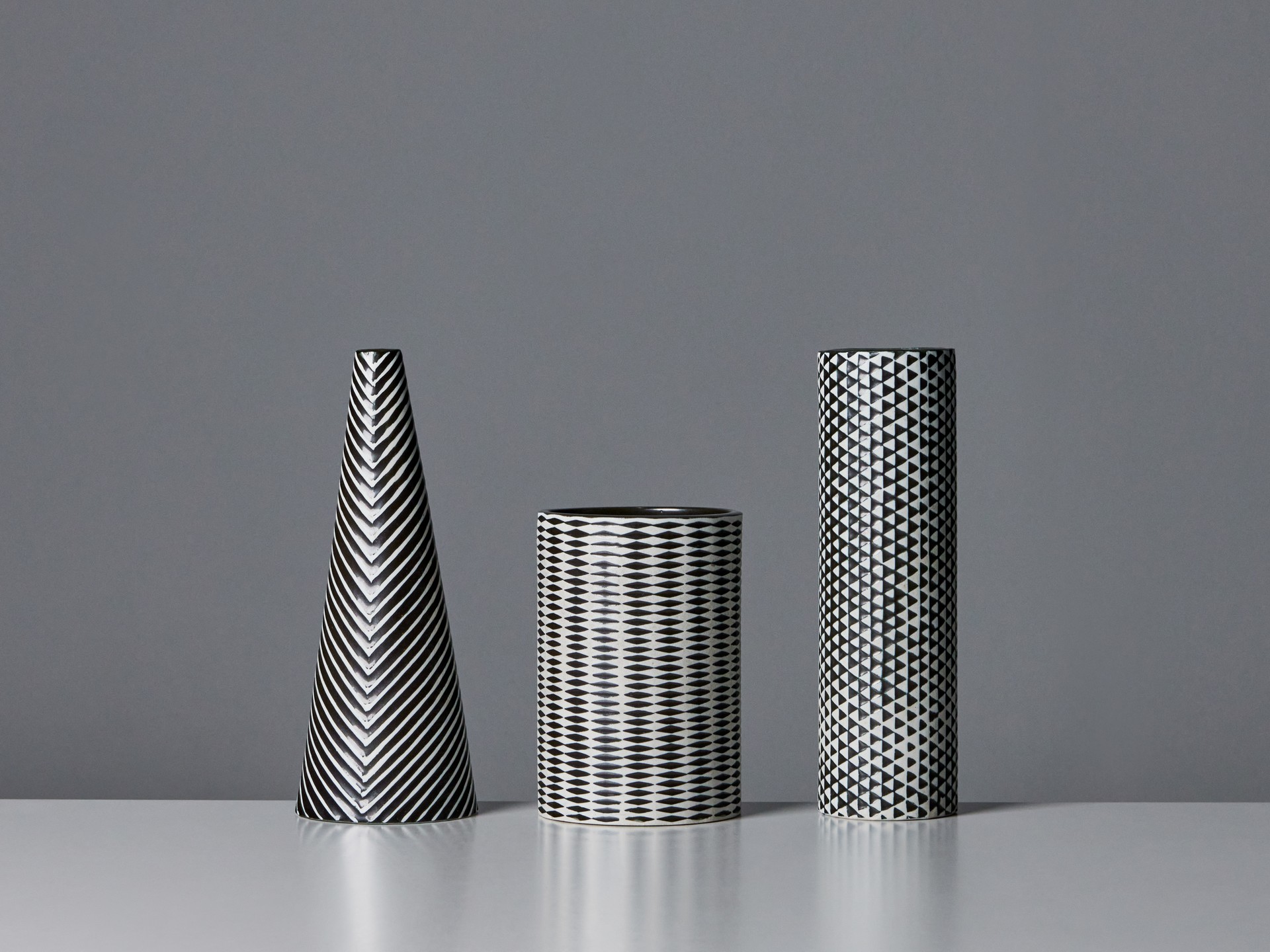 Three 'Domino' Vases