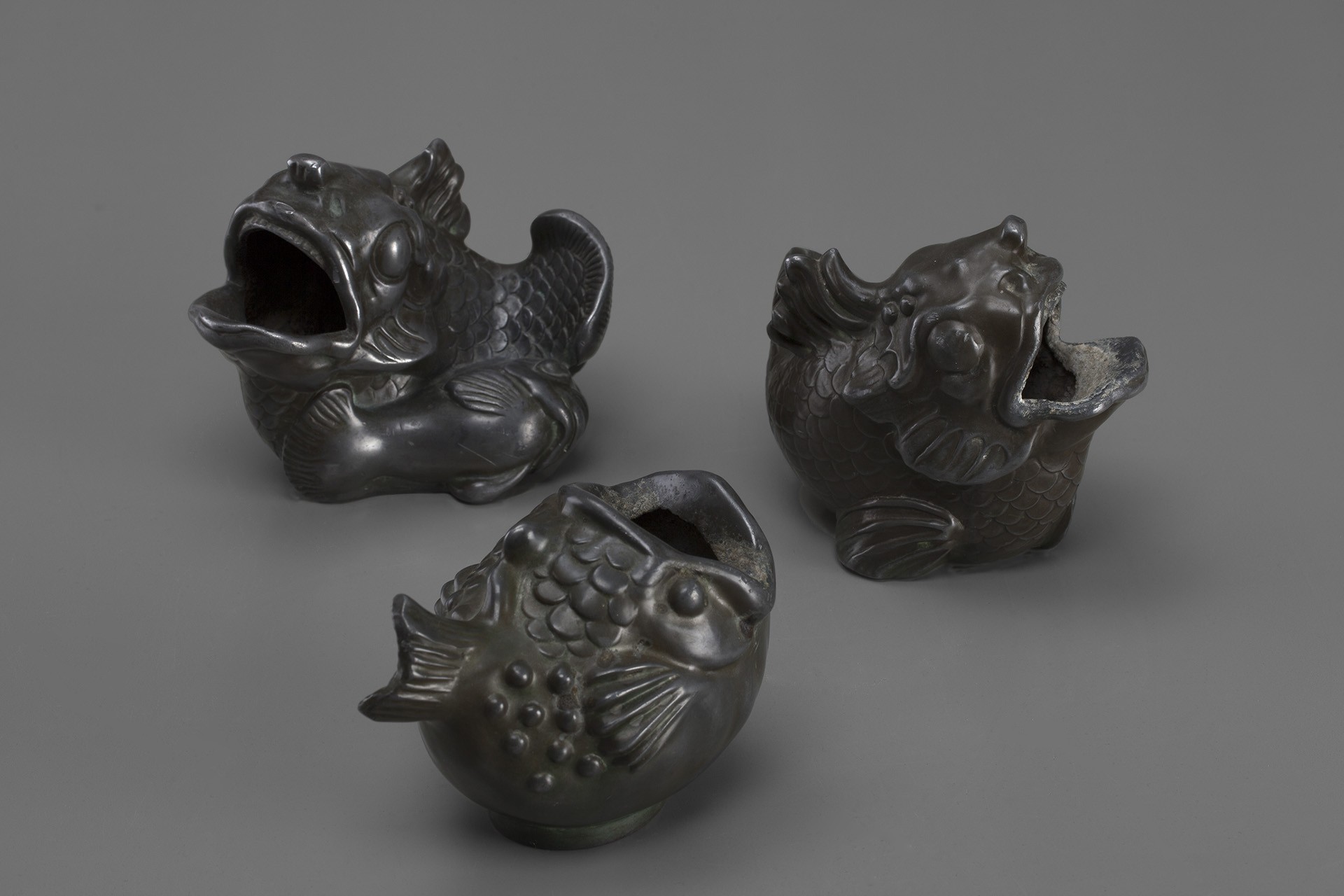 Three Carp Sculptures