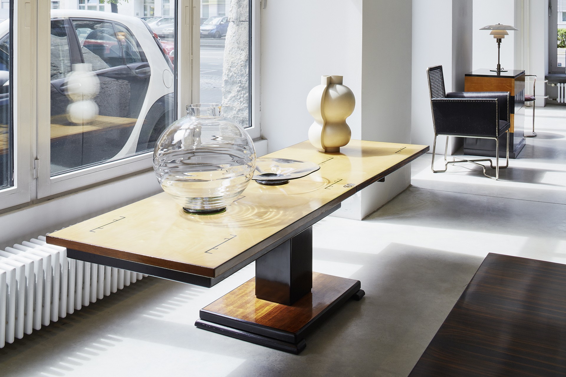 Ideal Table. Otto Wretling. 1930s. Rosewood top and base. Birch interior, black painted decoration. Black laquered column. Adjustable in height and length. Can function as a dining table, coffee table, or console table. Cabinetmaker Otto Wretling made furniture for the Royal Court. He designed the table together with his son Bo Wretling in 1935. Patented in 1936. Patent No 99346. Ref. 4559.