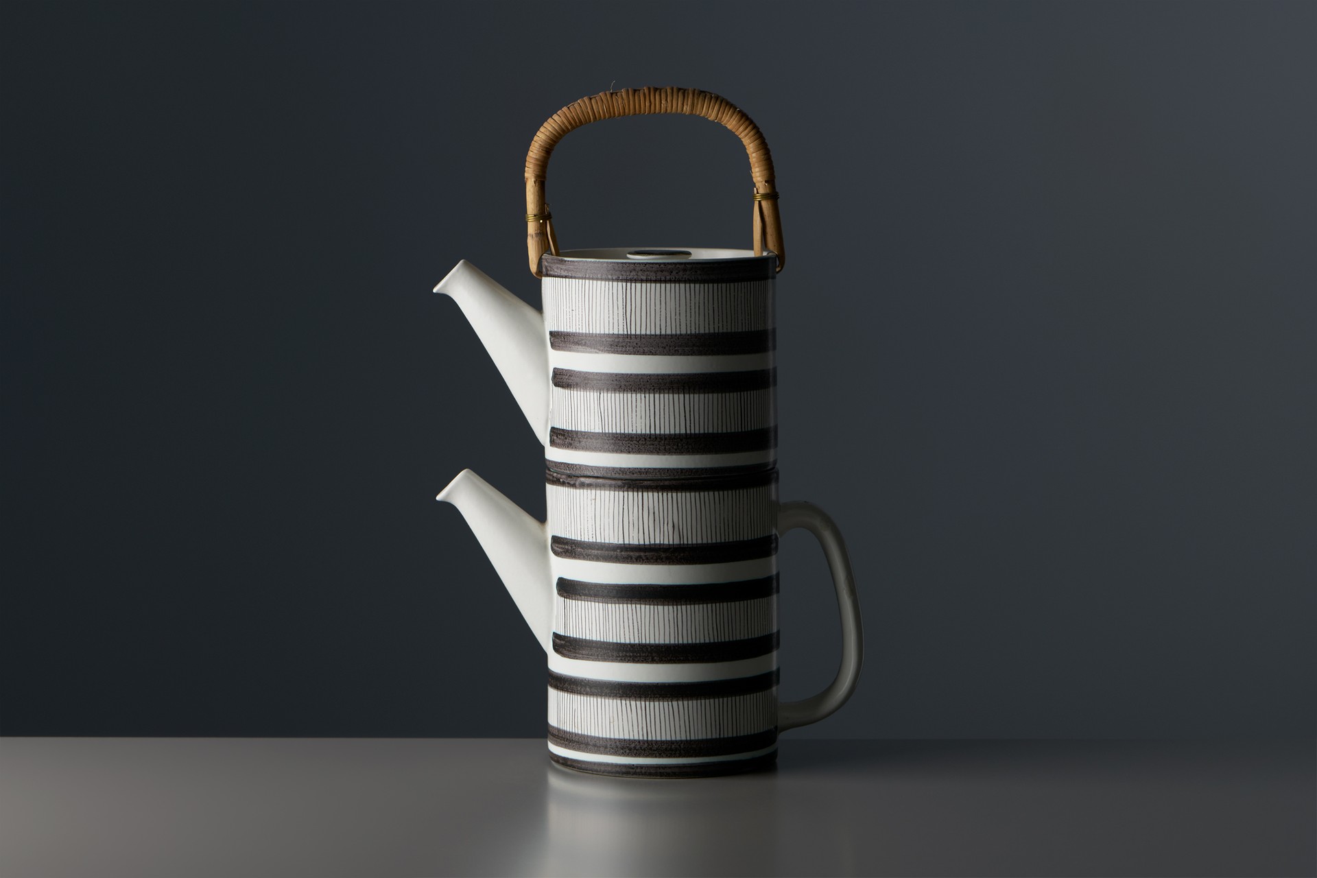 Stig Lindberg, 'Colorado' Teapots, 1960s, Glazed stoneware with faience decoration, bamboo, in two parts, Each stamped with manufacturer's marks, Produced by Gustavsberg Studio.