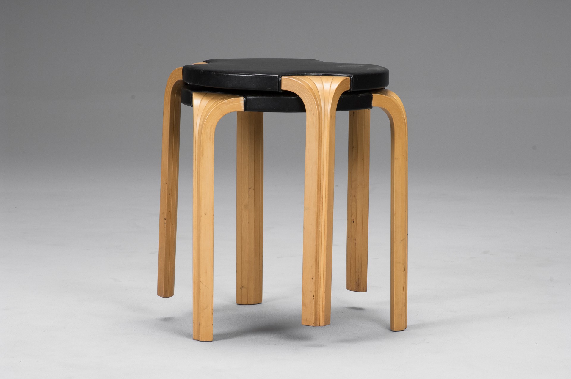 Original black leather "X 602" stools. Legs of bent massive birch. Design 1954. Patent No 154562 applied 3rd of April 1954.