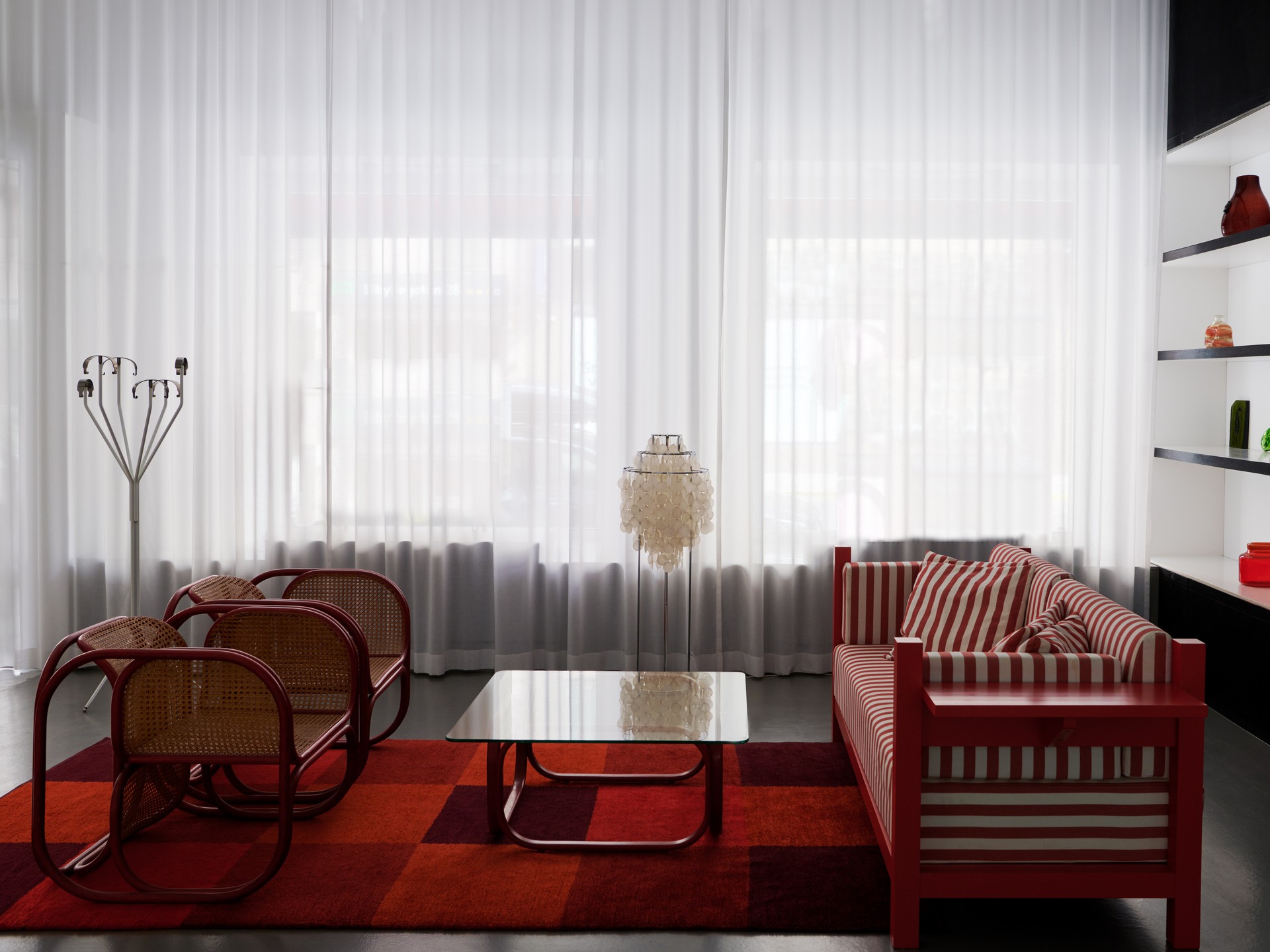 Pair of Easy Chairs from the Czechloslovak Embassy, Stockholm, Jan Bocan, Produced by Thonet, 1972, Red stained steam bent wood, ratan.
Coffee Table from the Czechloslovak Embassy, Stockholm, Jan Bocan, Produced by Thonet, 1972, Red stained steam bent wood, glass.