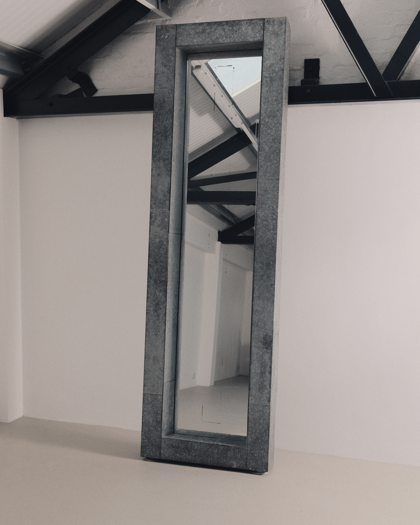 Custom oversized mirror in galvanised zinc by Tom Dixon
