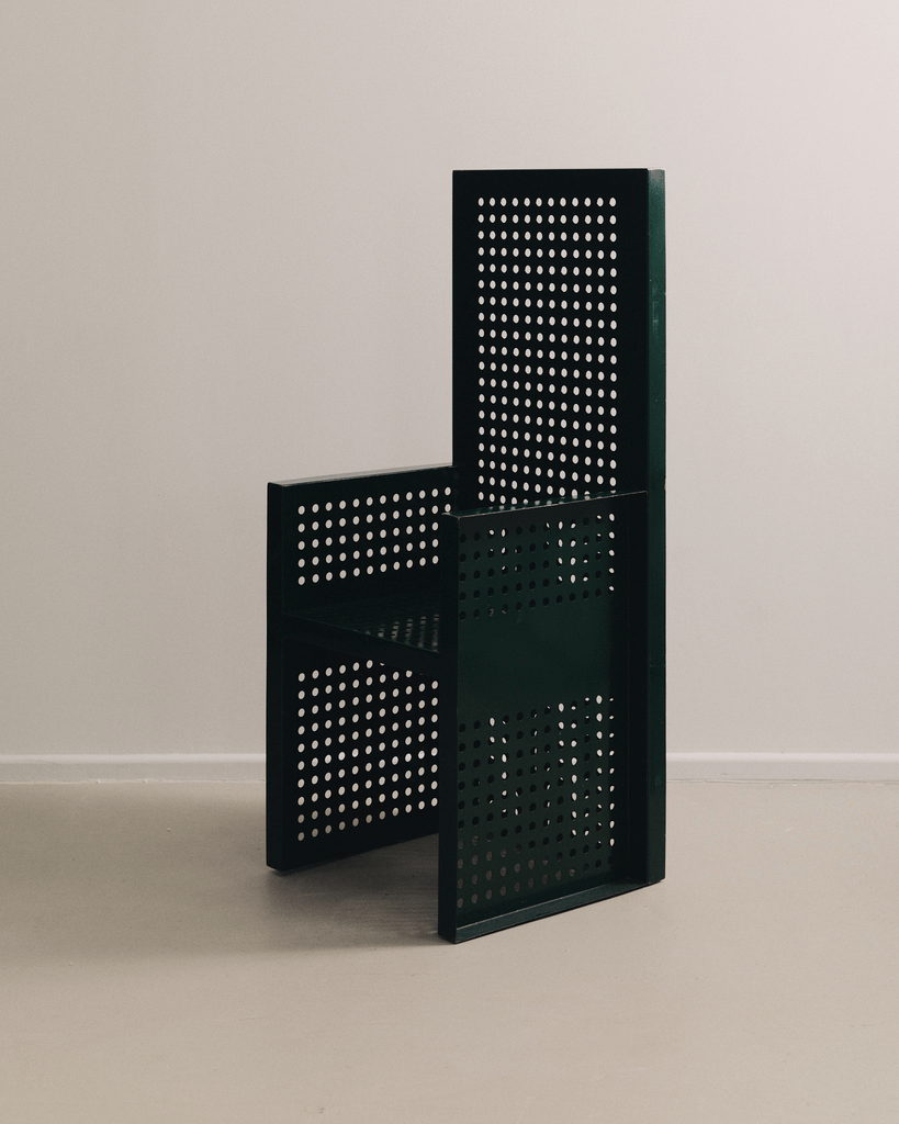 Perforated steel amchair by Urano Palma