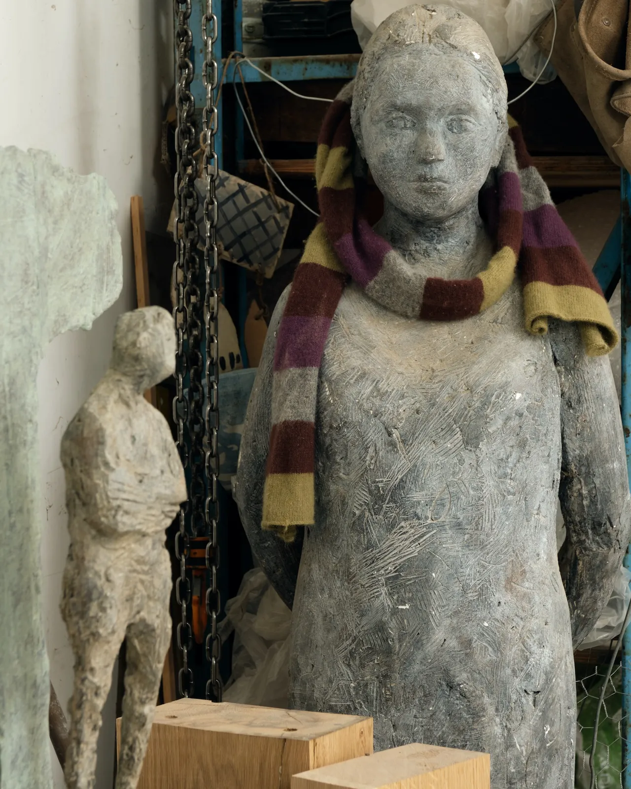 A sculpture of Christopher's daughter keeps him company in his studio