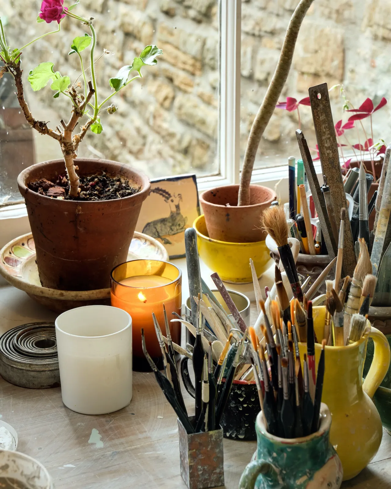 A candle is always burning when Claudia works in her studio