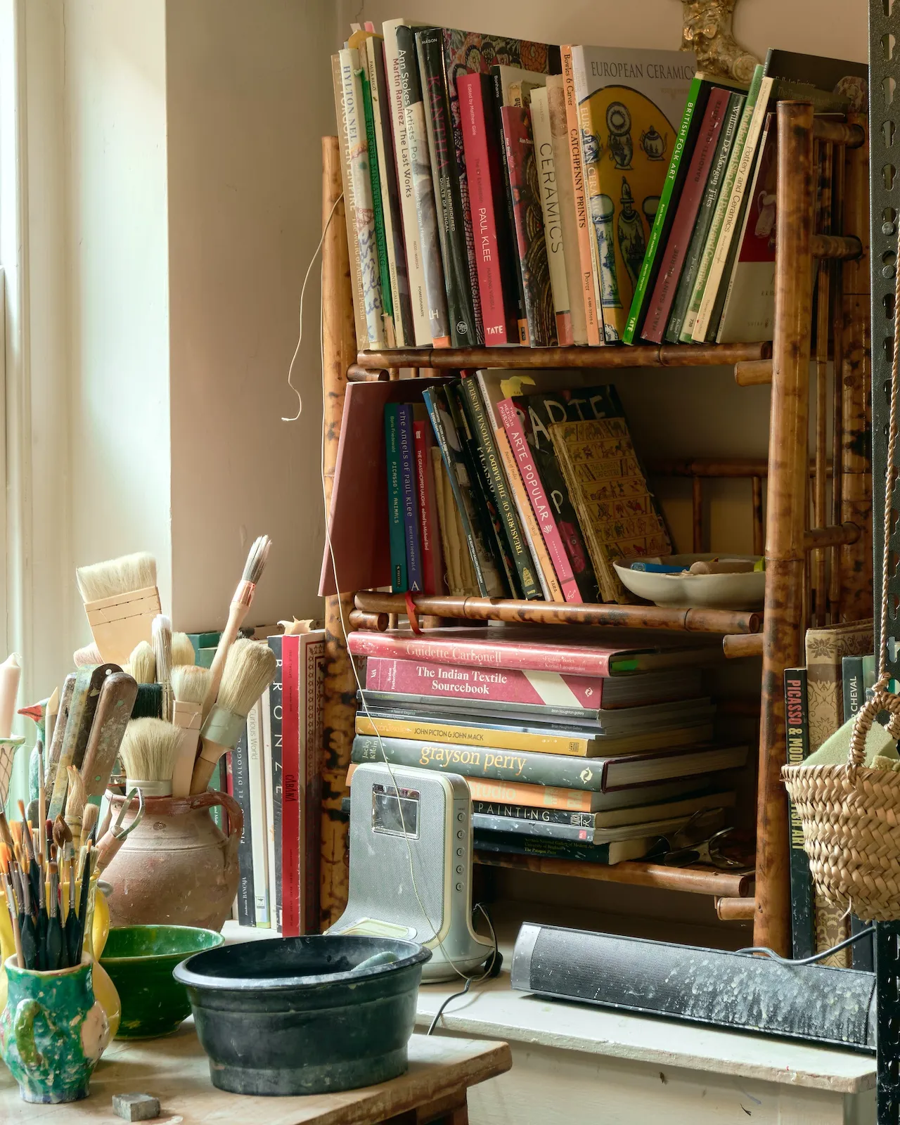 Reference books collected over the years sit beside Claudia's desk