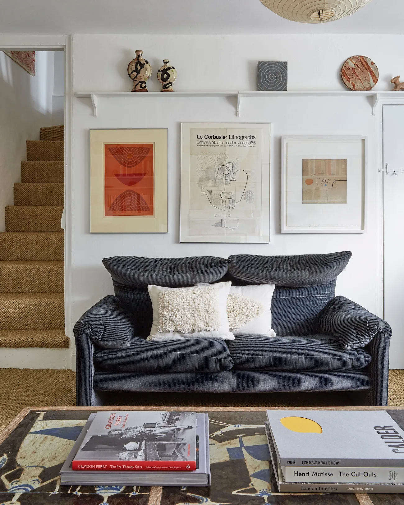 The first thing Tobias did when he took on the cottage was put down the sisal and paint everything white—then moved in the bits and pieces he’d built up over the years.