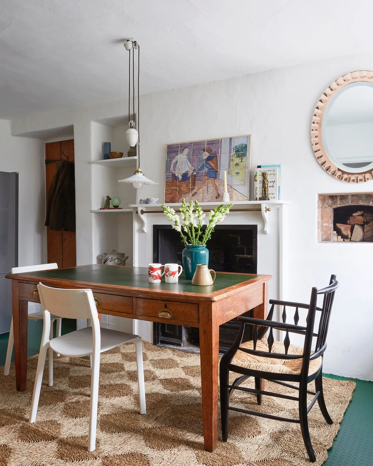 Tobias’s mother’s old Arts & Crafts desk doubles up as a dining table in the kitchen – perfect for cooling loaves out of the old (sadly disused) bread oven.