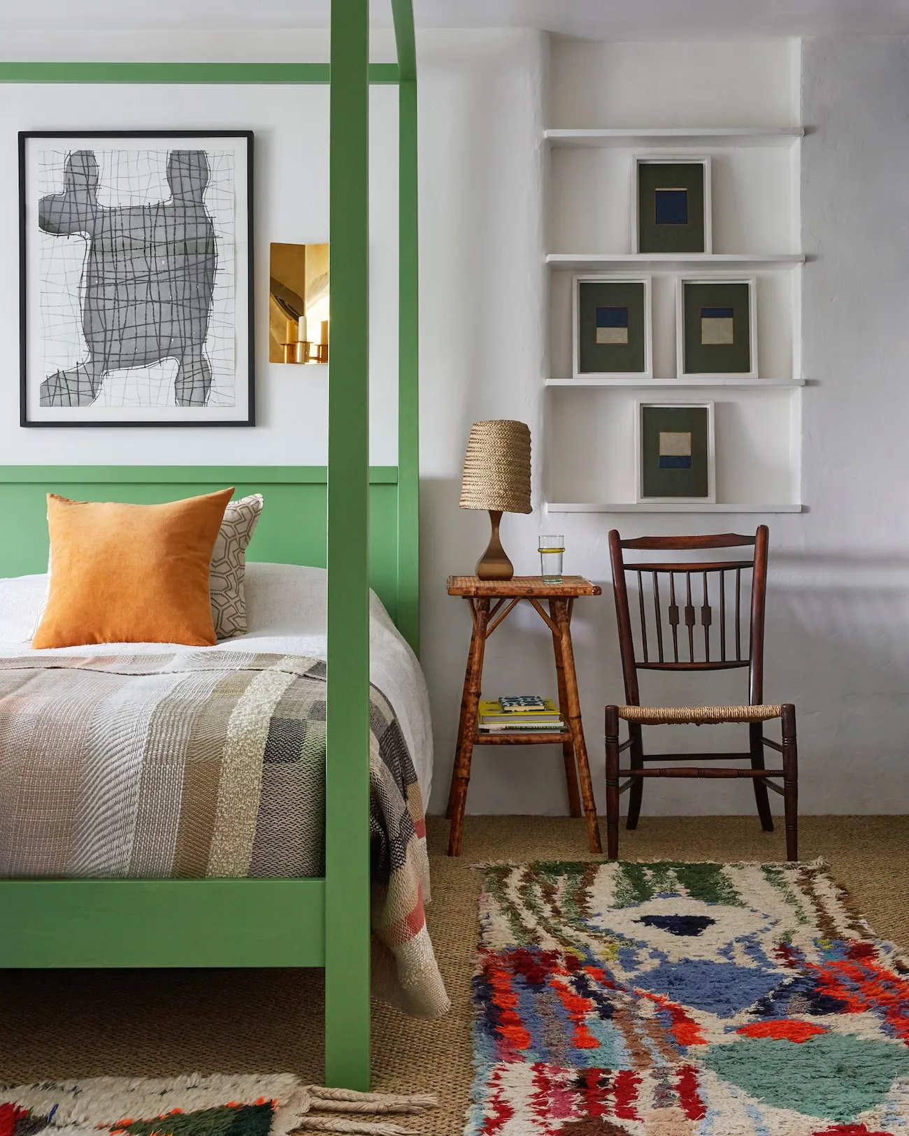 Tobias resides in a Habitat four-poster bed – given a grass green finish – with boucherouite Moroccan rugs on the floor in one of the two bedrooms upstairs.