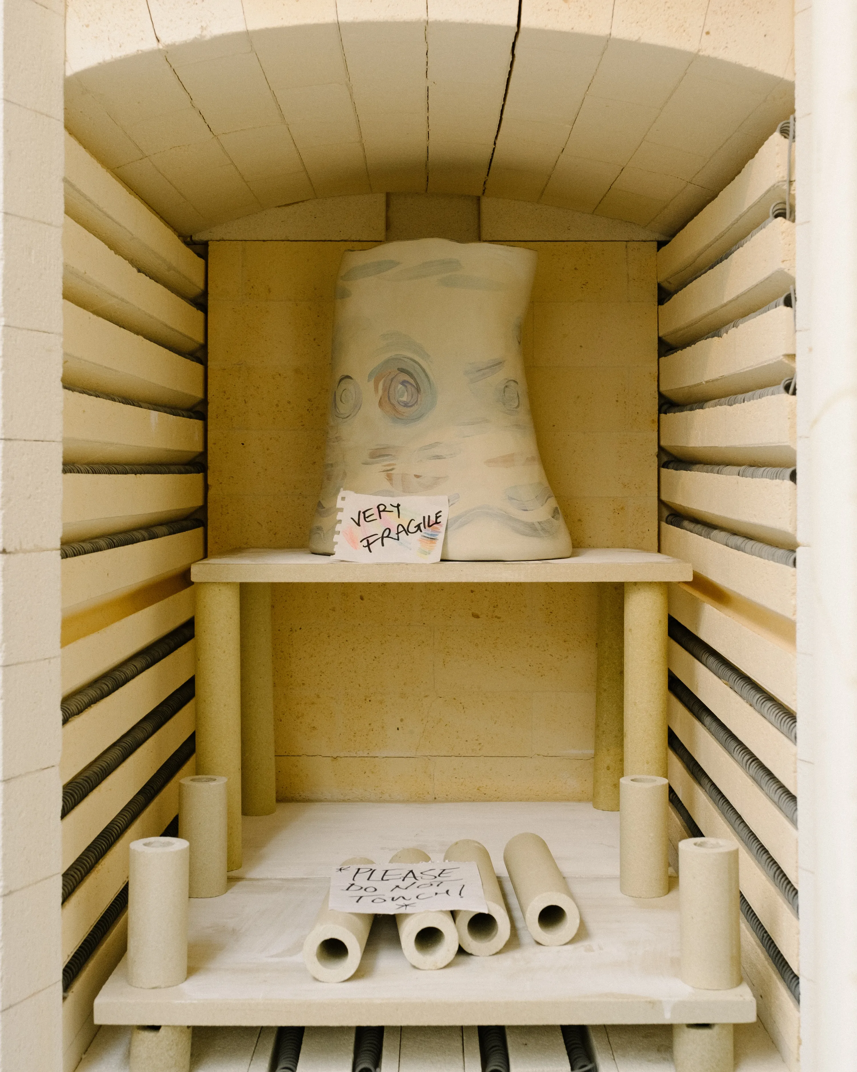 A biscuit fired piece awaiting its final moment in the kiln.